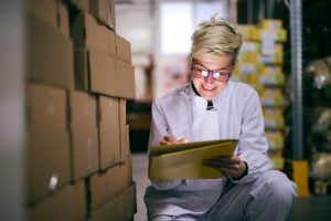 Business owner taking stock of goods